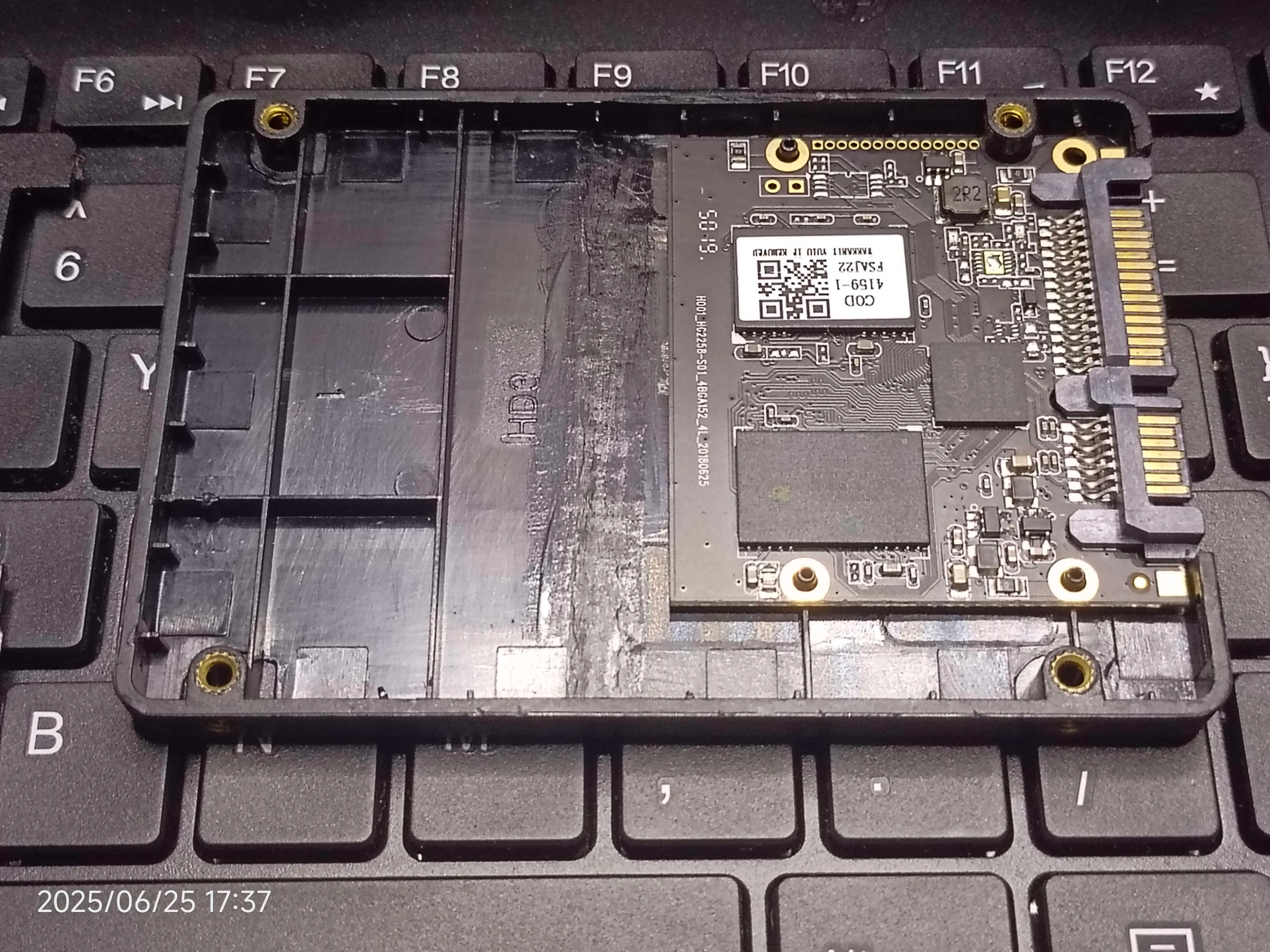 The internals inside the SSD, revealing its motherboard